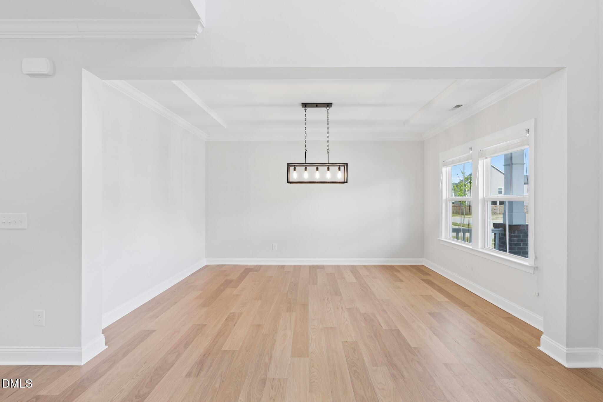 2616 Nordmann Fir Road Raleigh, NC 27616 - Photo 10 of 53 a view of empty room with wooden floor and fan
