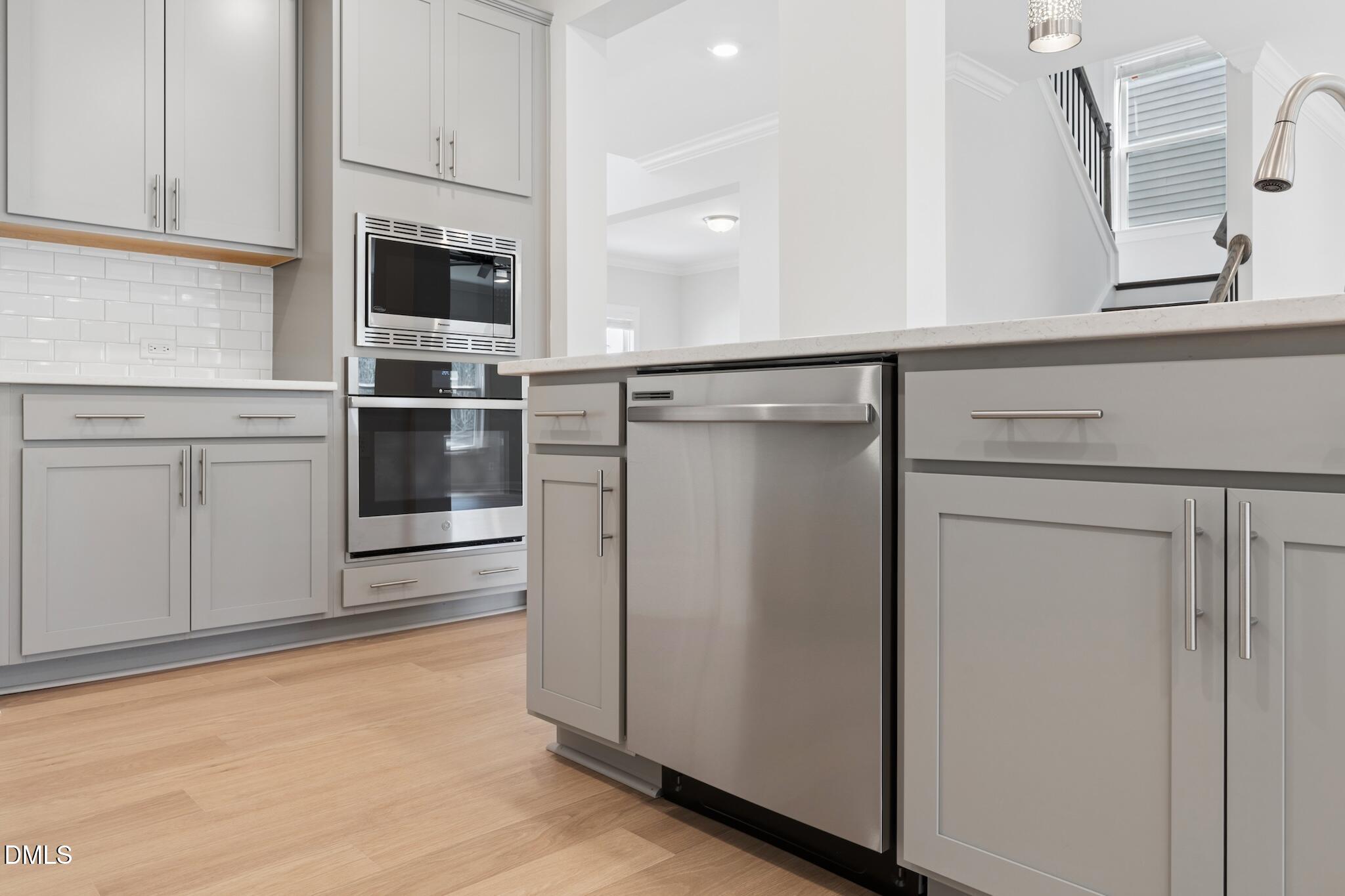 2616 Nordmann Fir Road Raleigh, NC 27616 - Photo 21 of 53 a kitchen with stainless steel appliances a refrigerator and cabinets