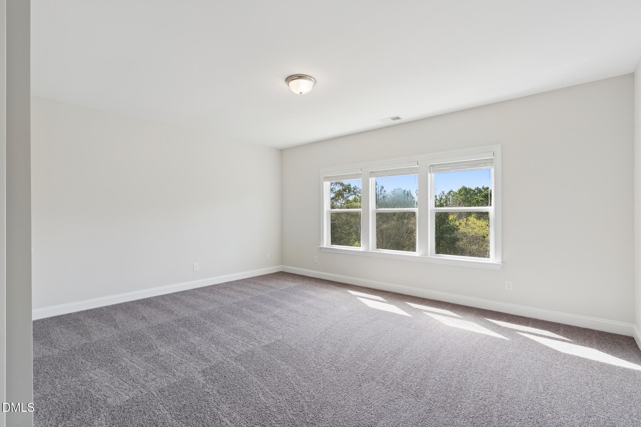 2616 Nordmann Fir Road Raleigh, NC 27616 - Photo 29 of 53 an empty room with a window