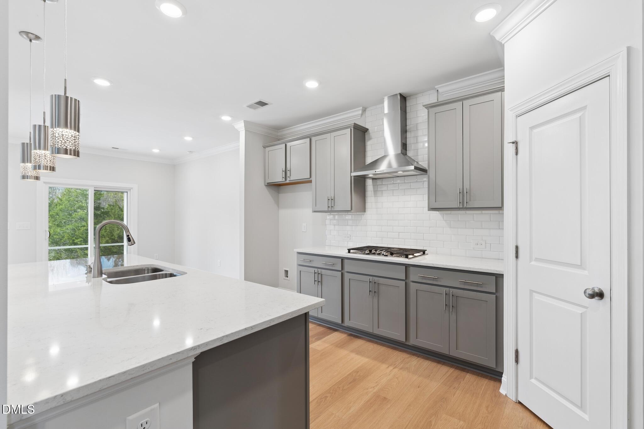 2616 Nordmann Fir Road Raleigh, NC 27616 - Photo 2 of 53 a kitchen with stainless steel appliances granite countertop a sink and a stove