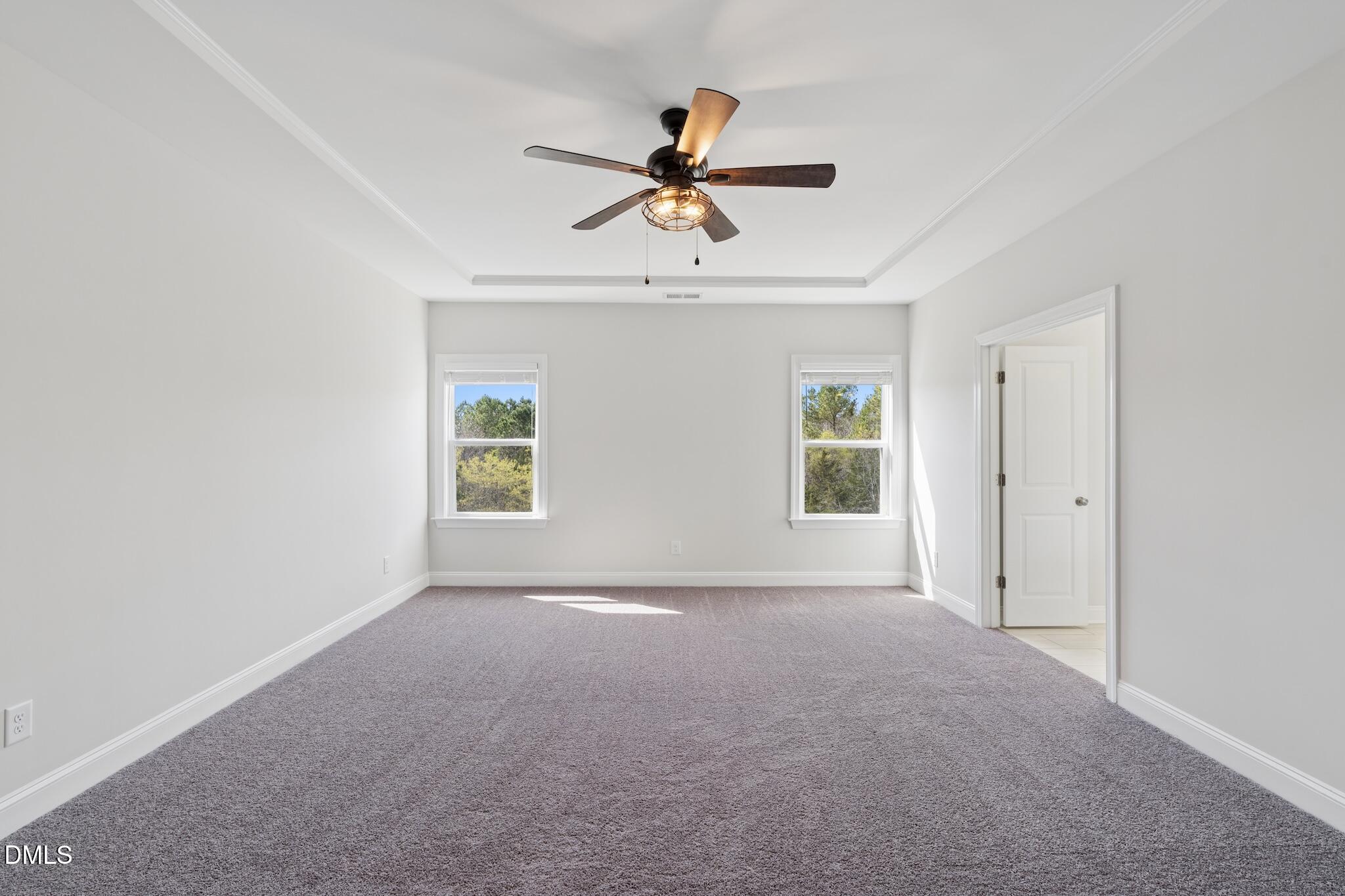 2616 Nordmann Fir Road Raleigh, NC 27616 - Photo 33 of 53 a view of a livingroom with a ceiling fan and window