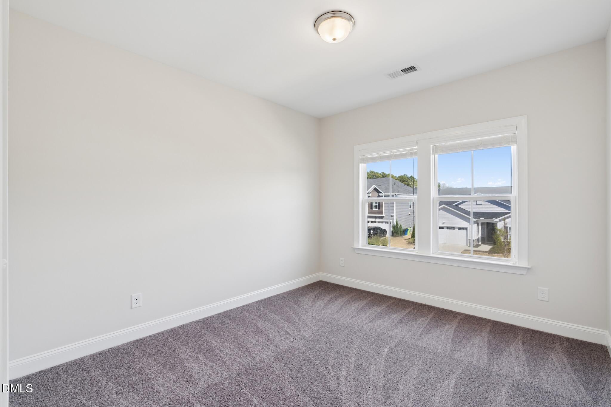 2616 Nordmann Fir Road Raleigh, NC 27616 - Photo 37 of 53 an empty room with windows