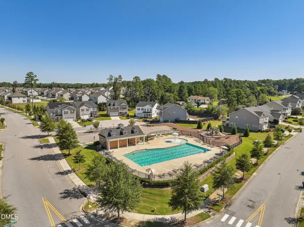 a sign that is sitting in front of flowers