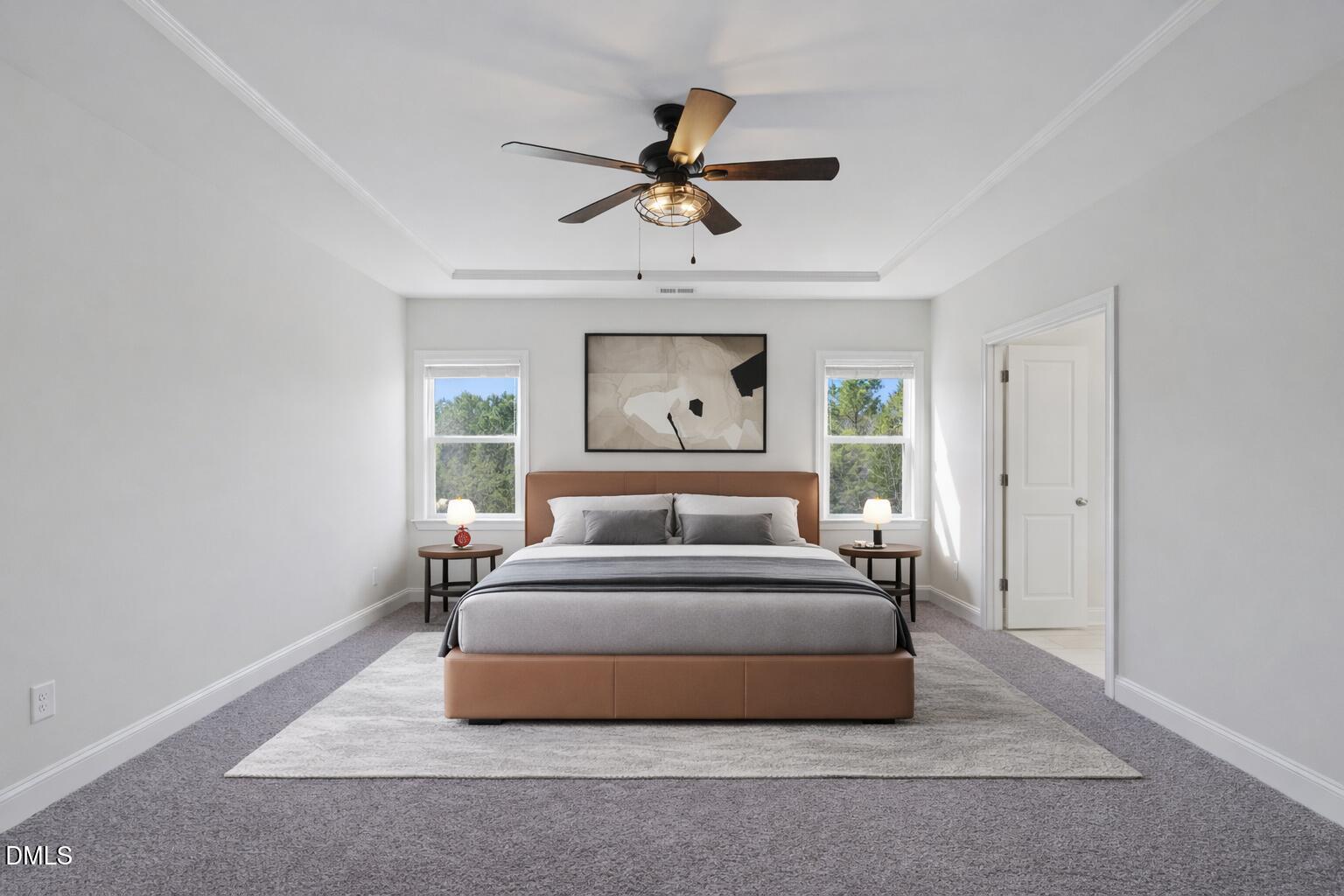 2616 Nordmann Fir Road Raleigh, NC 27616 - Photo 5 of 53 a bedroom with a large bed and a chandelier