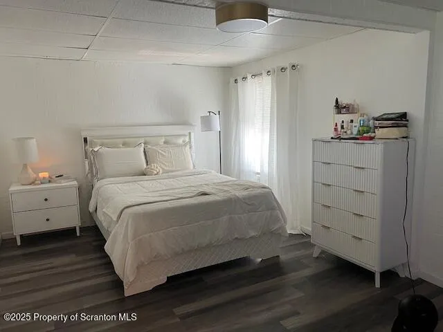 a bedroom with furniture and a window