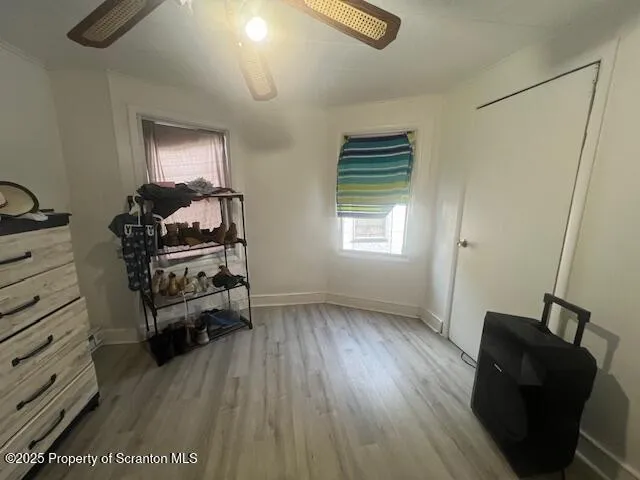 a bedroom with a bed and a mirror