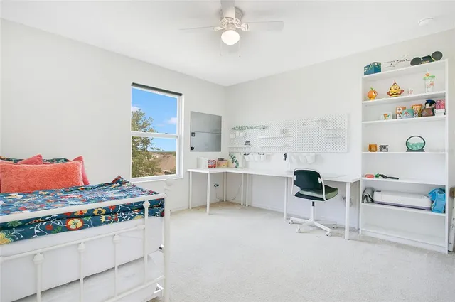 a kitchen with a stove and white cabinets