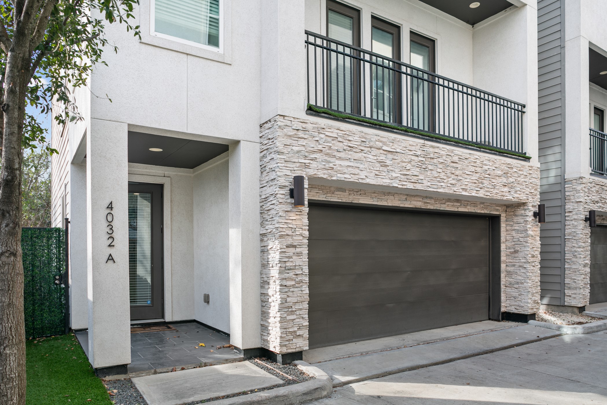 a view of front door and small yard