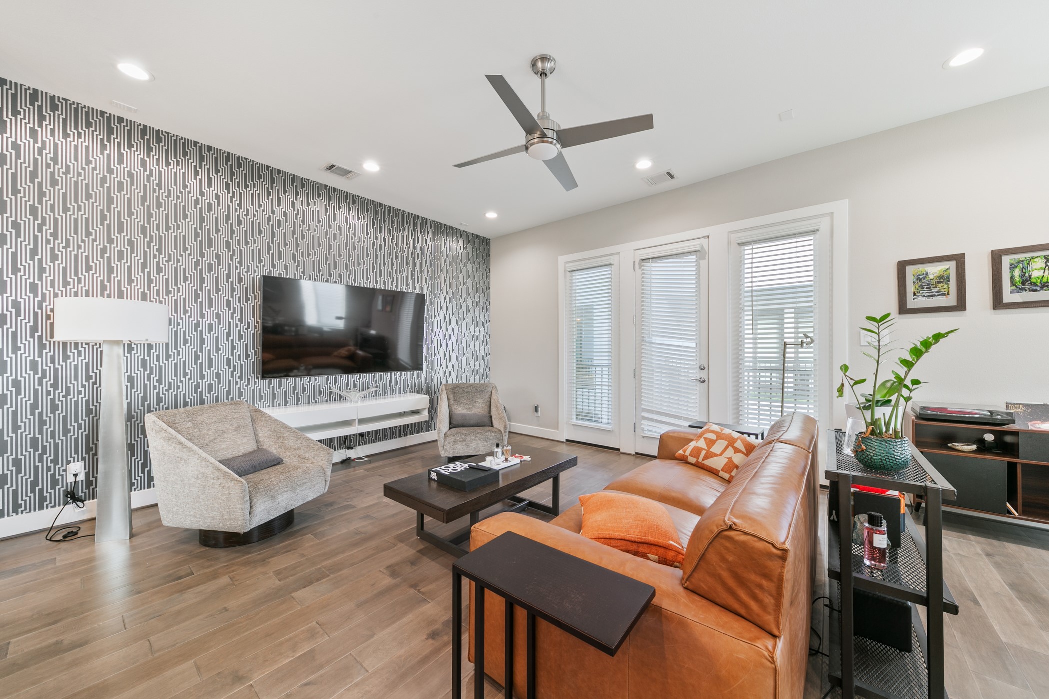 4032 Buck Street, Unit A Houston, TX 77020 - Photo 13 of 39 a living room with furniture and a flat screen tv