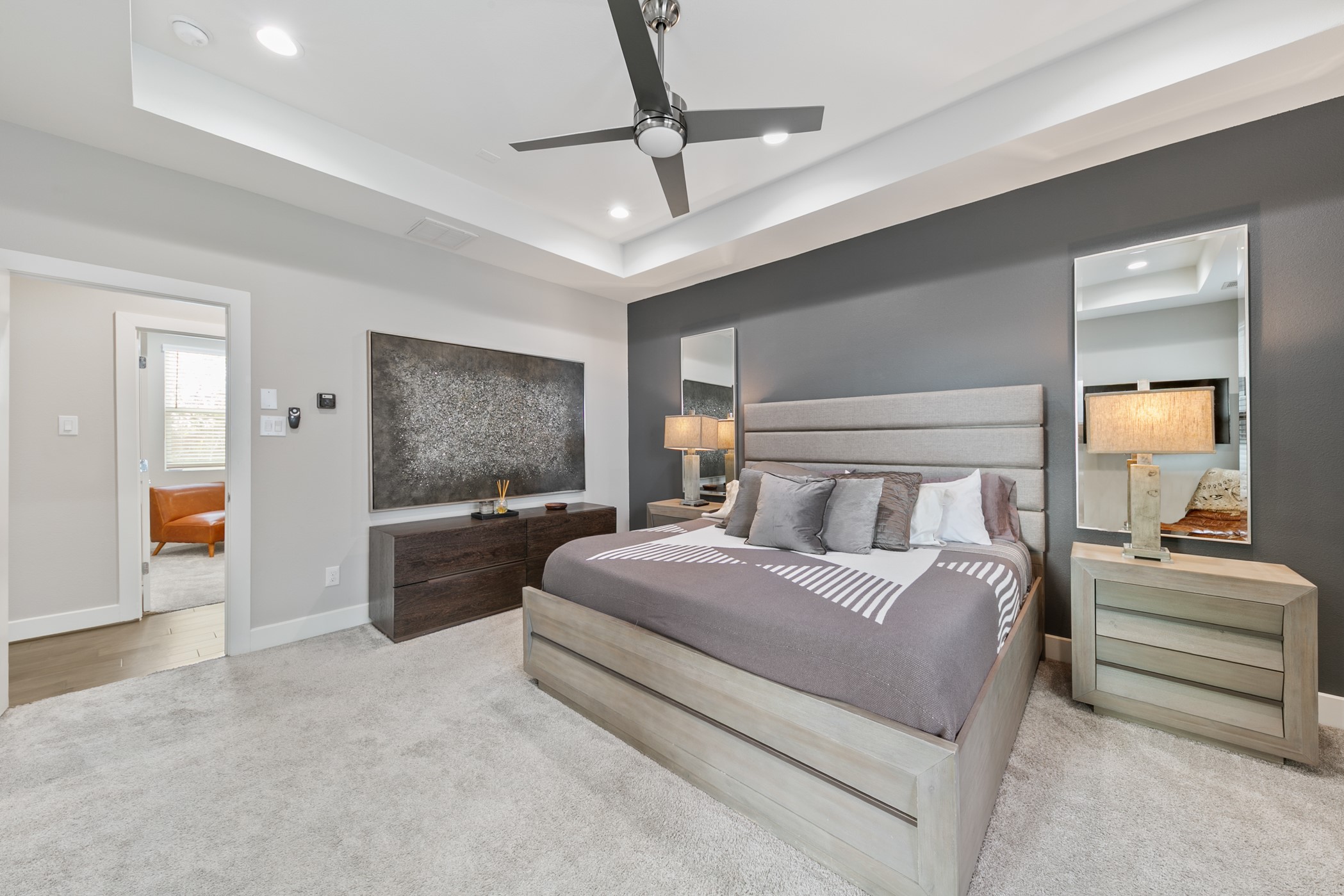 4032 Buck Street, Unit A Houston, TX 77020 - Photo 26 of 39 a bedroom with a large bed and a chandelier