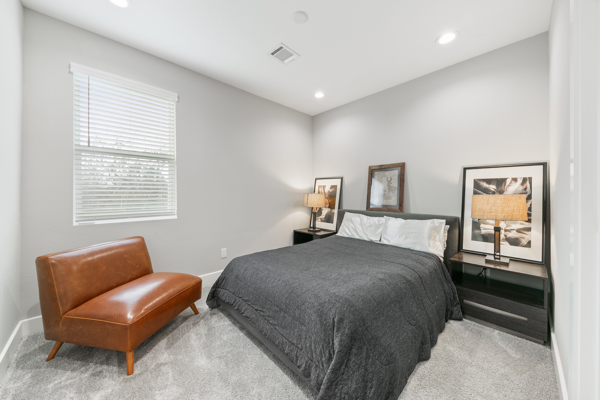 4032 Buck Street, Unit A Houston, TX 77020 - Photo 30 of 39 a bedroom with a bed and a couch