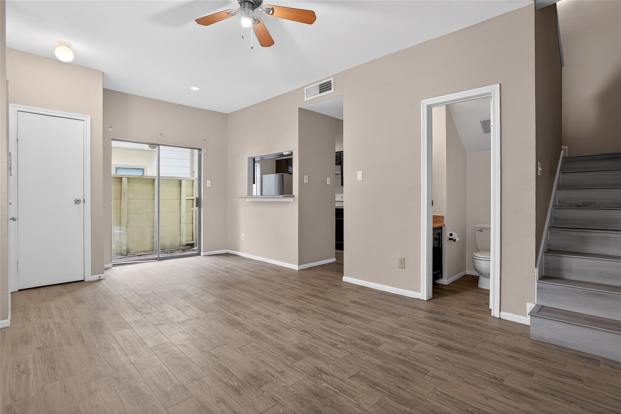 8299 Cambridge Street, Unit 706 Houston, TX 77054 - Photo 12 of 30 wooden floor in an empty room with a window