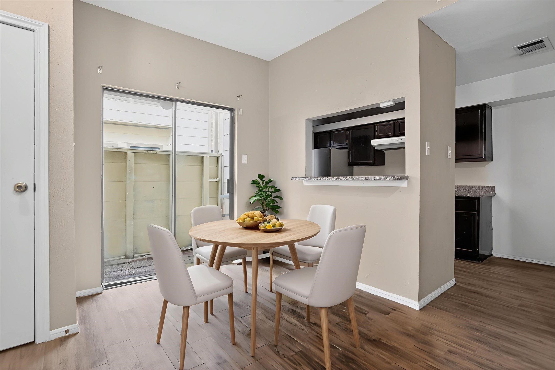 8299 Cambridge Street, Unit 706 Houston, TX 77054 - Photo 24 of 30 a view of a dining room with furniture and wooden floor