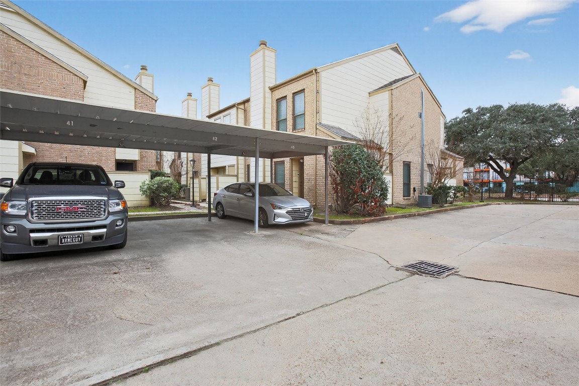 8299 Cambridge Street, Unit 706 Houston, TX 77054 - Photo 27 of 30 a view of a cars park in front of house