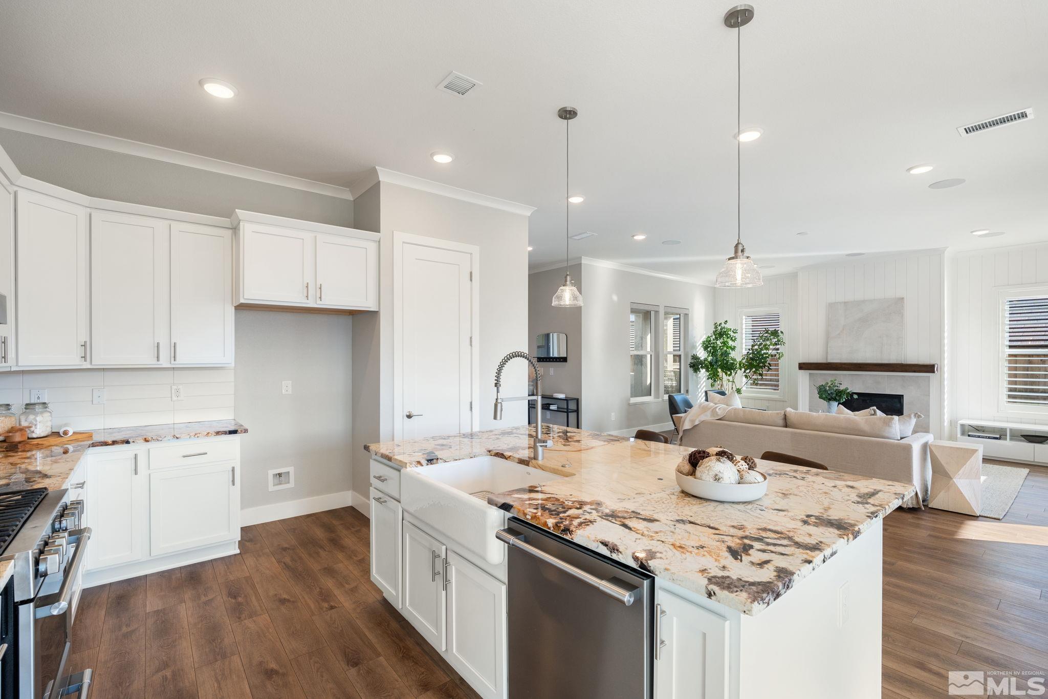 1621 Huntley Trail Reno, NV 89523 - Photo 16 of 40 a kitchen with sink stove and white cabinets with wooden floor