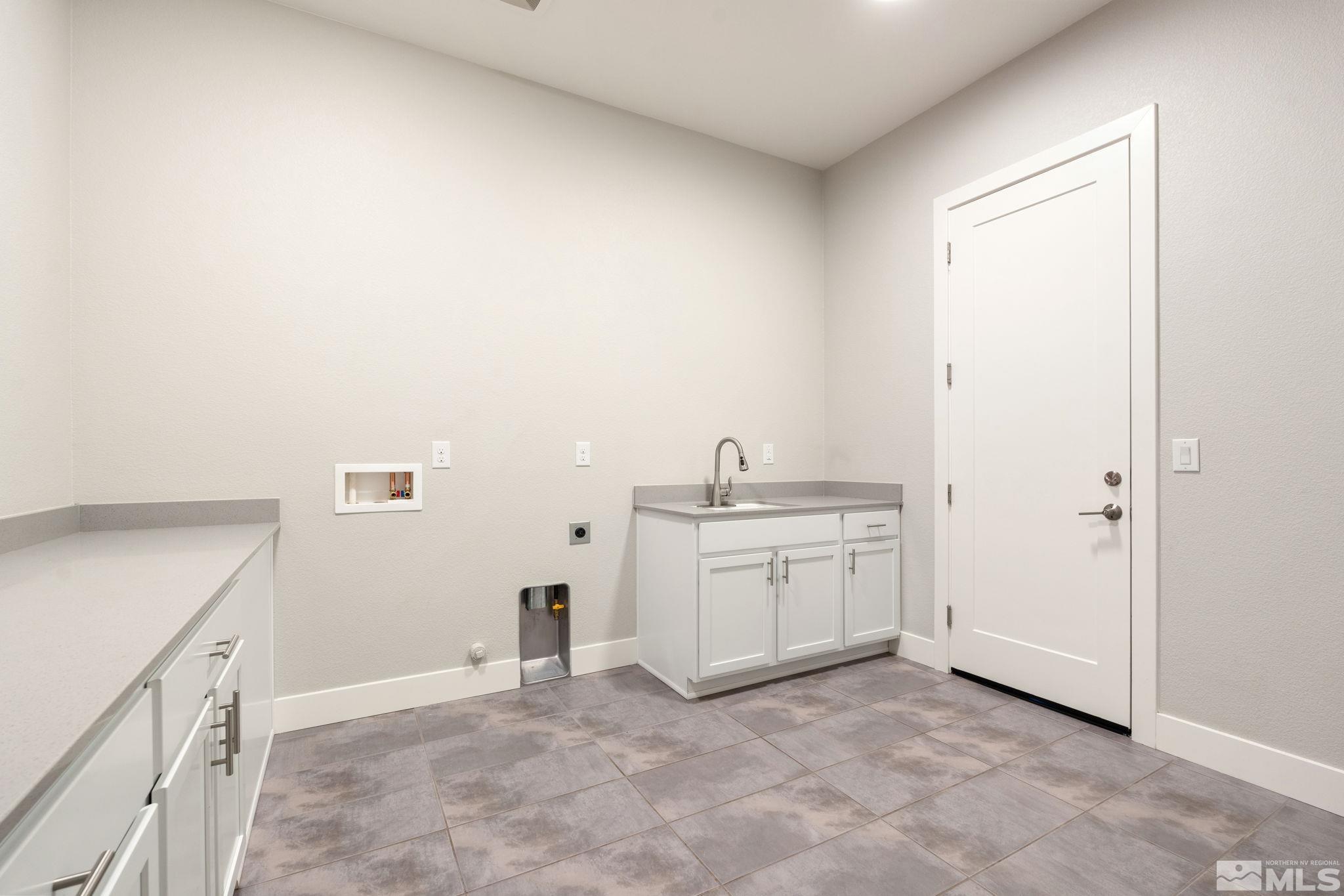 1621 Huntley Trail Reno, NV 89523 - Photo 27 of 40 a view of a kitchen with sink cabinets and a window