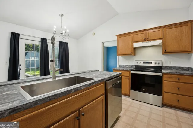 a kitchen with a stove and a sink