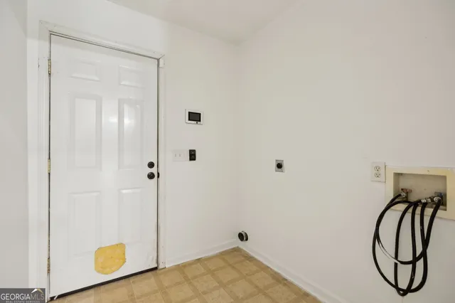 a front view of a house with a big yard