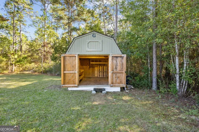 a view of a wooden door of the house
