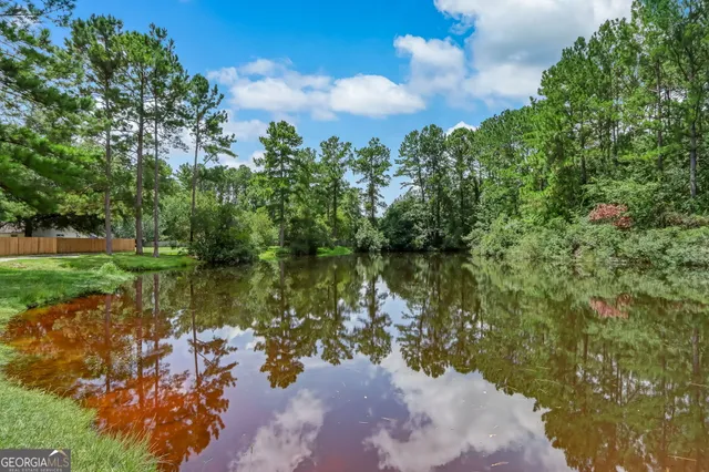 a view of a lake with a building in the background