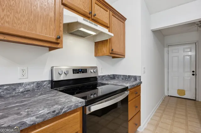 a kitchen with a stove and a microwave