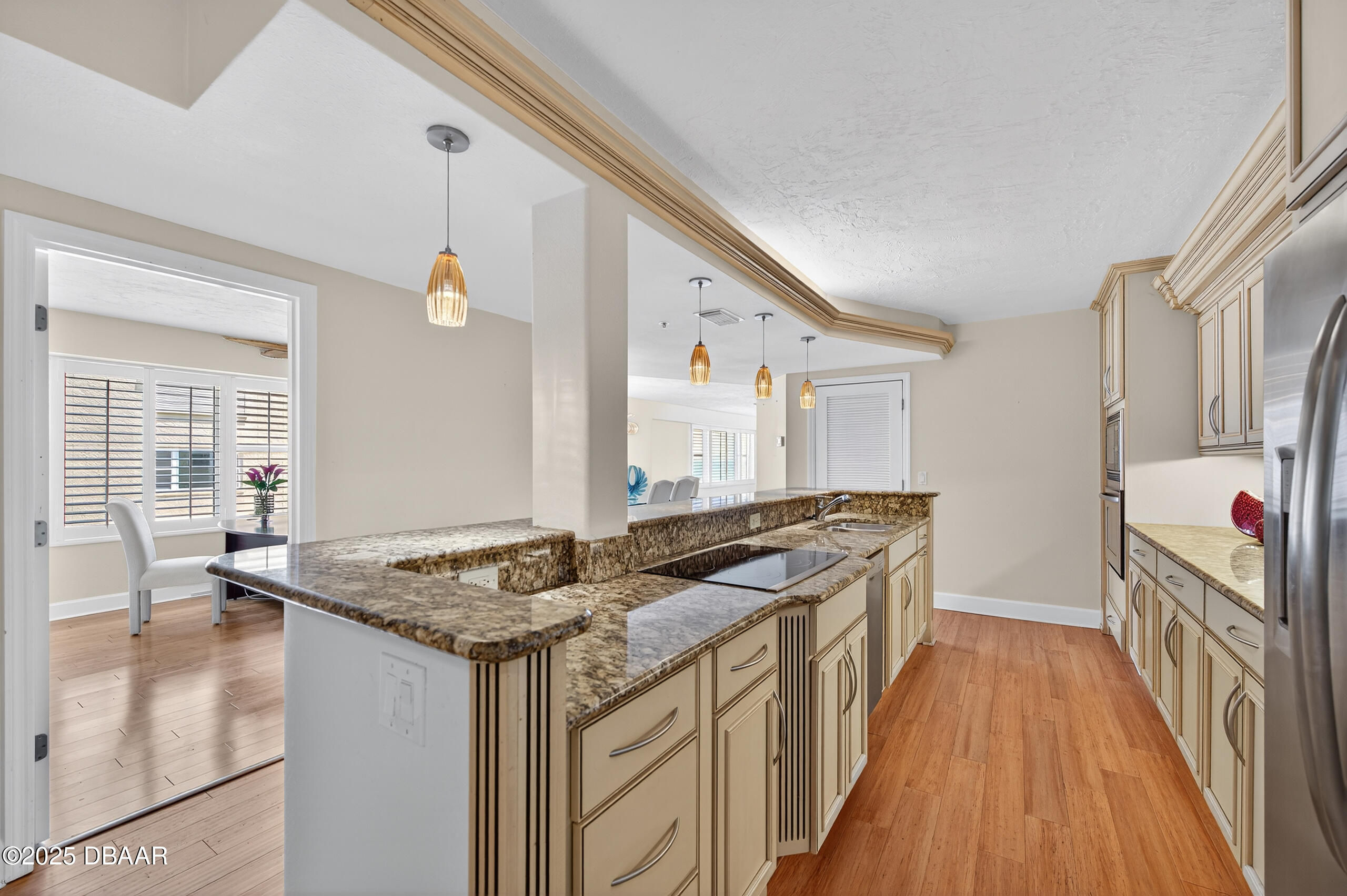 4555 South Atlantic Avenue, Unit 4603 Ponce Inlet, FL 32127 - Photo 23 of 39 a kitchen with stainless steel appliances granite countertop a stove and a sink