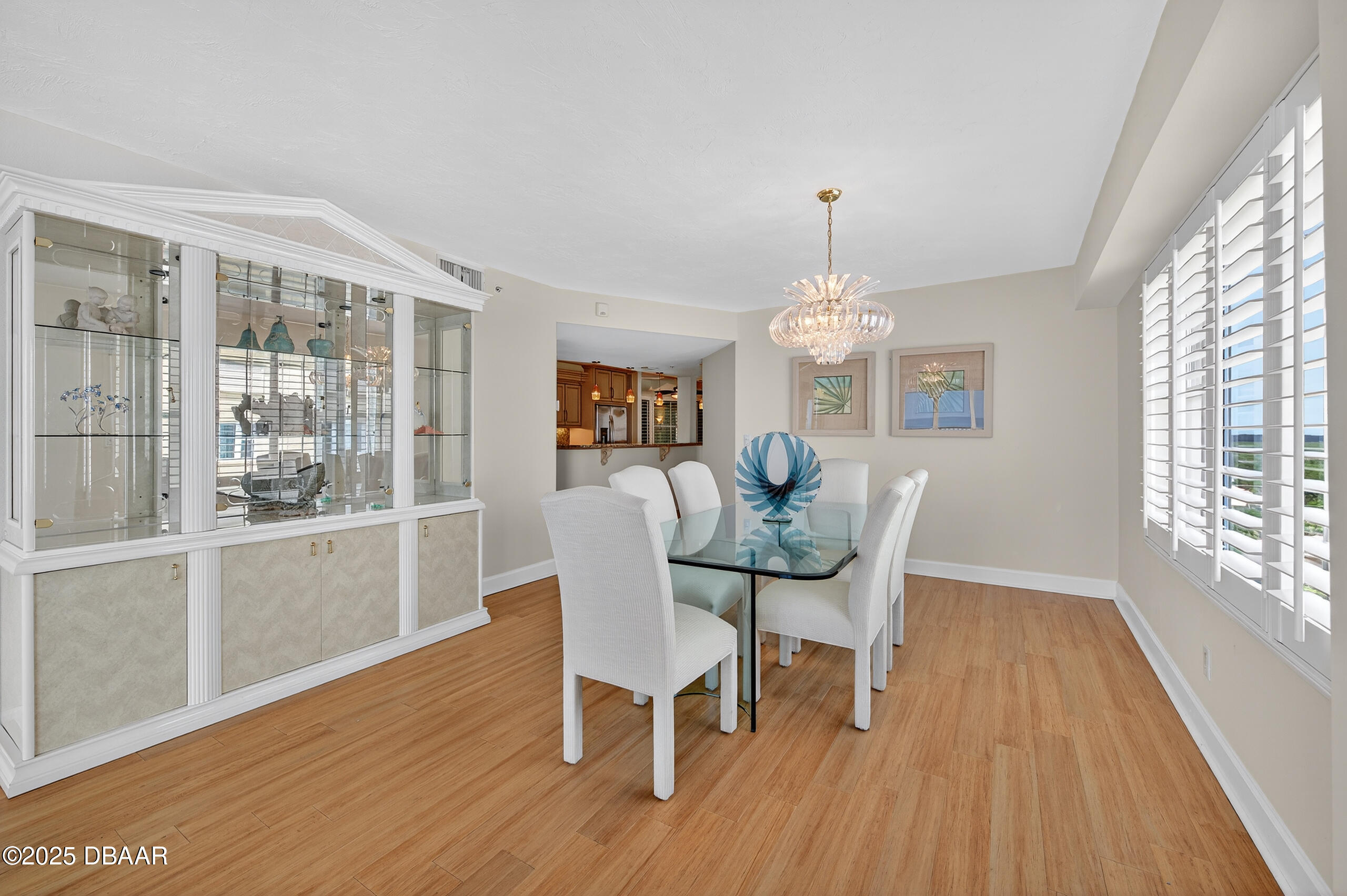 4555 South Atlantic Avenue, Unit 4603 Ponce Inlet, FL 32127 - Photo 24 of 39 a view of a dining room with furniture window and wooden floor