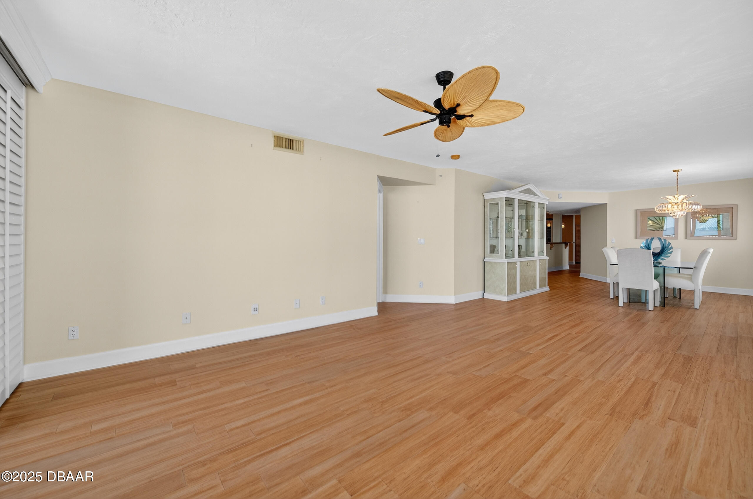 4555 South Atlantic Avenue, Unit 4603 Ponce Inlet, FL 32127 - Photo 26 of 39 a view of a livingroom with wooden floor and a ceiling fan