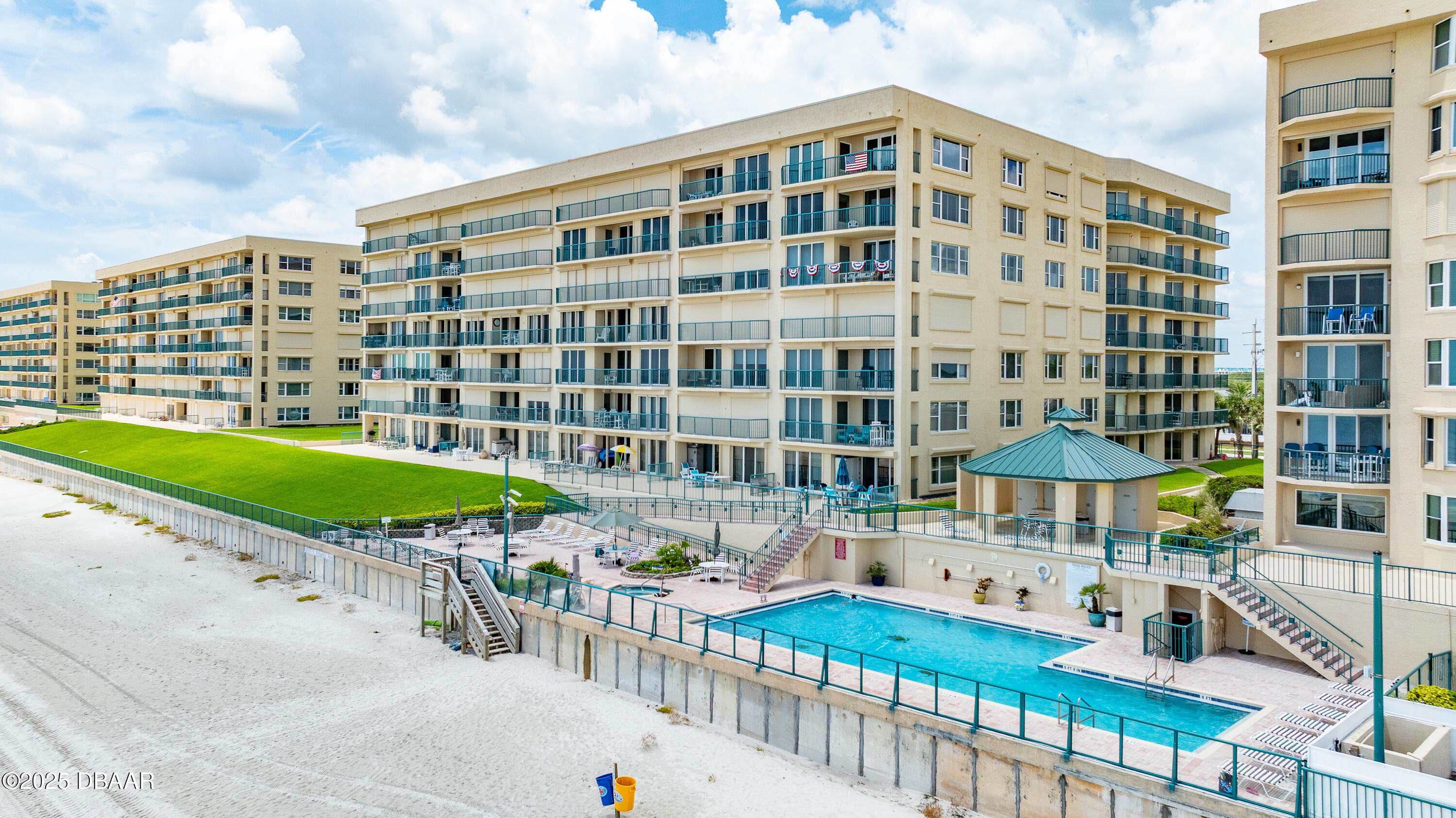 4555 South Atlantic Avenue, Unit 4603 Ponce Inlet, FL 32127 - Photo 27 of 39 a view of a building with a yard