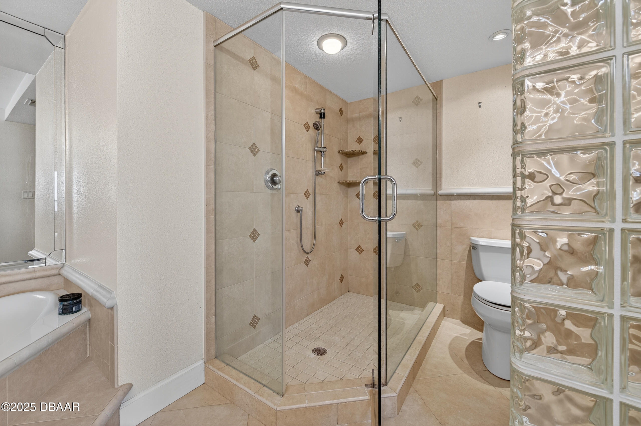 4555 South Atlantic Avenue, Unit 4603 Ponce Inlet, FL 32127 - Photo 30 of 39 a bathroom with a shower and a toilet