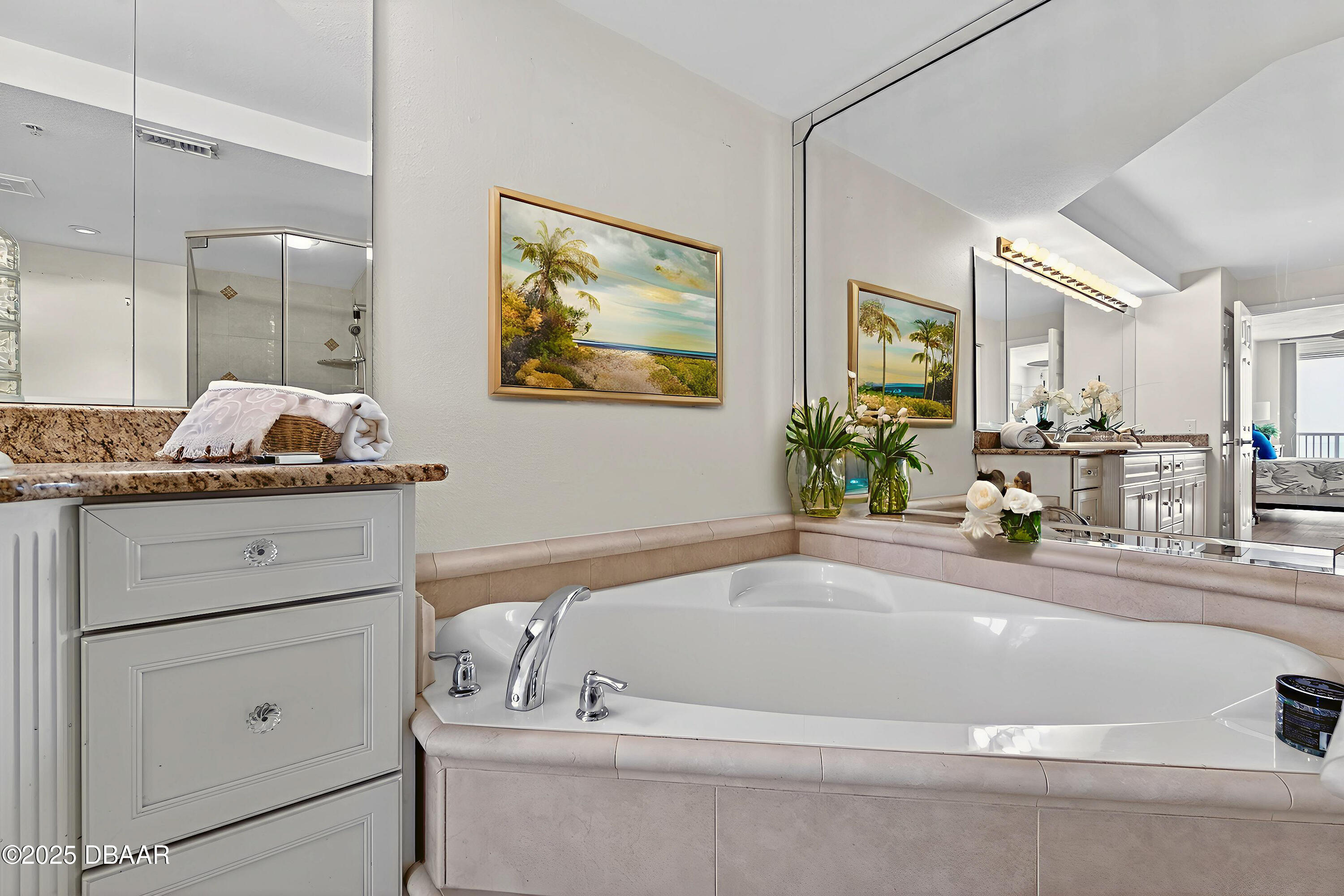 4555 South Atlantic Avenue, Unit 4603 Ponce Inlet, FL 32127 - Photo 36 of 39 a bath tub sitting next to a bathroom sink
