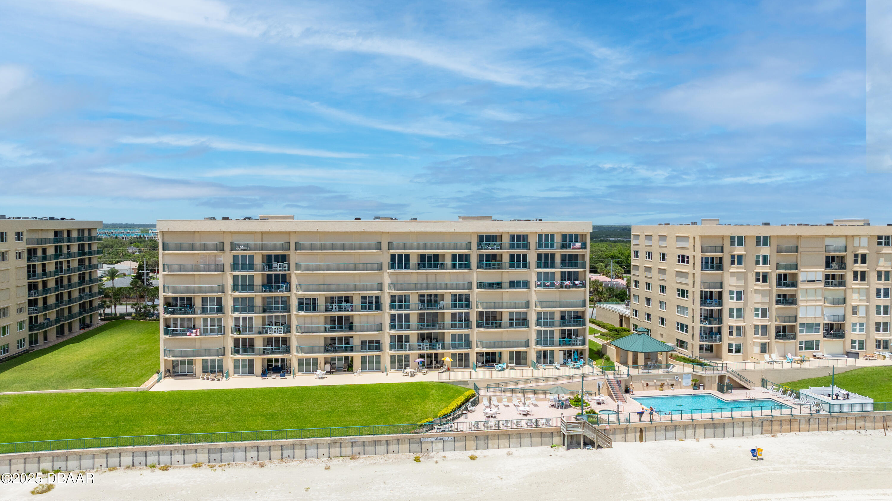 4555 South Atlantic Avenue, Unit 4603 Ponce Inlet, FL 32127 - Photo 39 of 39 a front view of a building with a garden