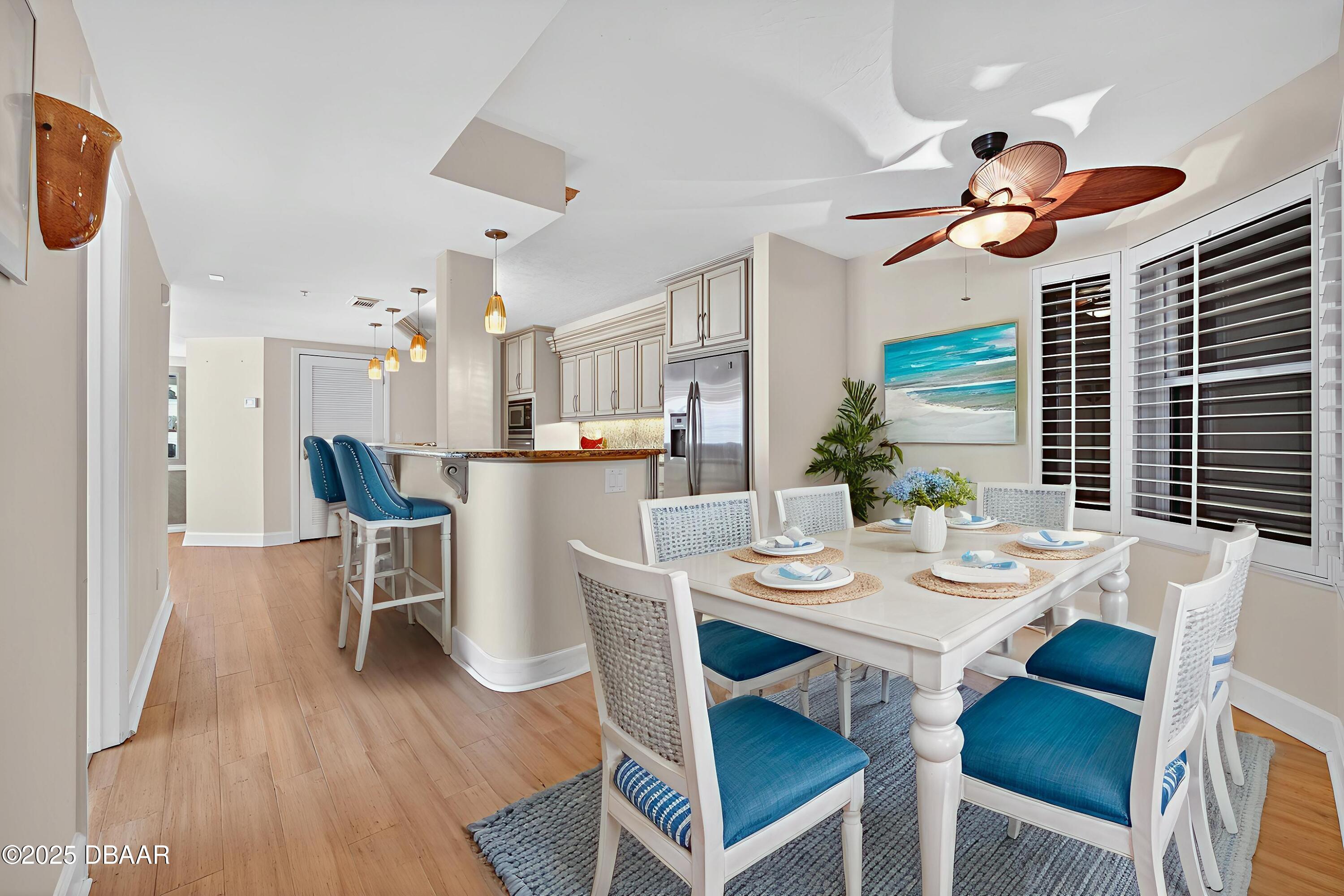 4555 South Atlantic Avenue, Unit 4603 Ponce Inlet, FL 32127 - Photo 6 of 39 a view of a dining room with furniture and wooden floor