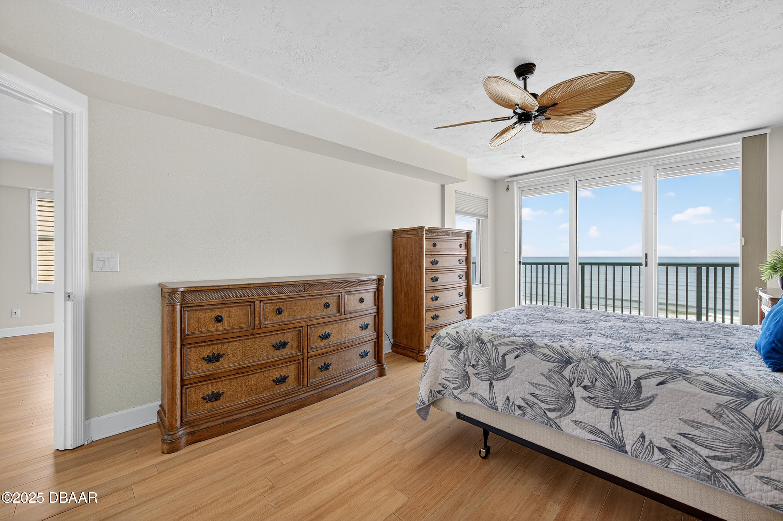 4555 South Atlantic Avenue, Unit 4603 Ponce Inlet, FL 32127 - Photo 9 of 39 a bedroom with a bed dresser and a window