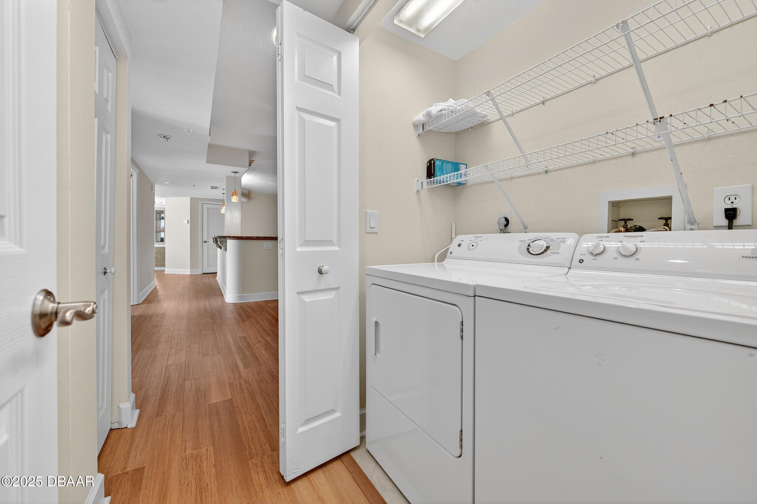 4555 South Atlantic Avenue, Unit 4603 Ponce Inlet, FL 32127 - Photo 10 of 39 a room with a sink washer and dryer
