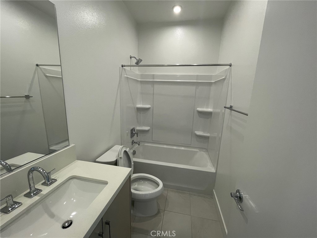 691 South Lyon Street Santa Ana, CA 92705 - Photo 14 of 17 a bathroom with a sink a toilet and shower