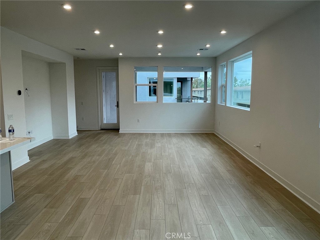 691 South Lyon Street Santa Ana, CA 92705 - Photo 6 of 17 a view of empty room with wooden floor and fan