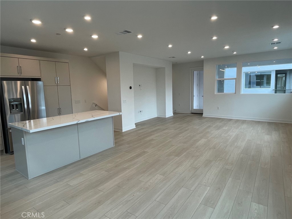 691 South Lyon Street Santa Ana, CA 92705 - Photo 8 of 17 a view of kitchen with stainless steel appliances refrigerator sink and cabinets