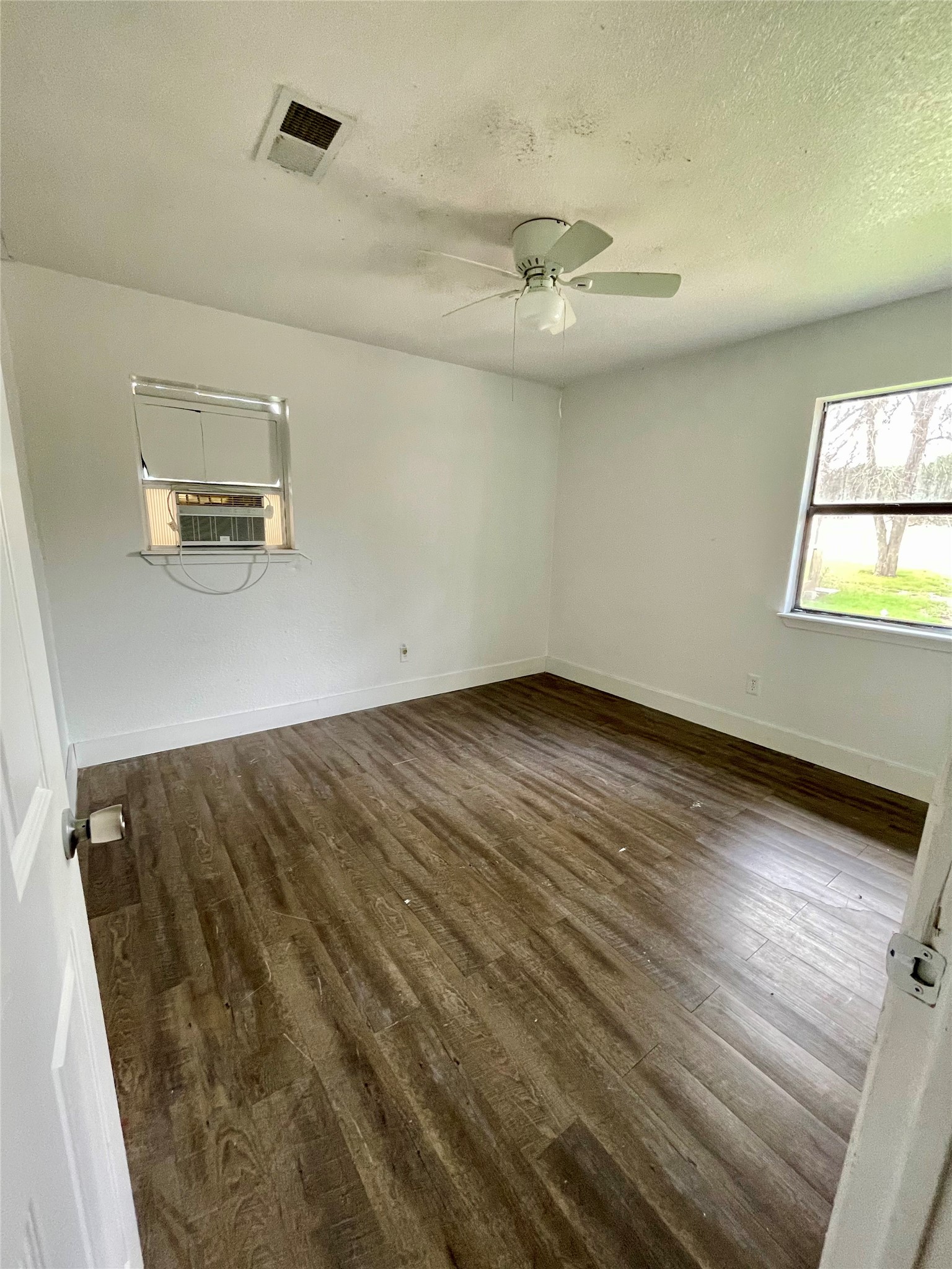 893 County Road 3376 Kempner, TX 76539 - Photo 13 of 23 wooden floor in an empty room with a window