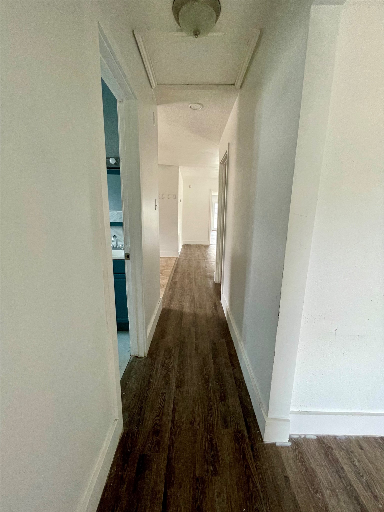 893 County Road 3376 Kempner, TX 76539 - Photo 18 of 23 a view of a hallway with wooden floor and staircase