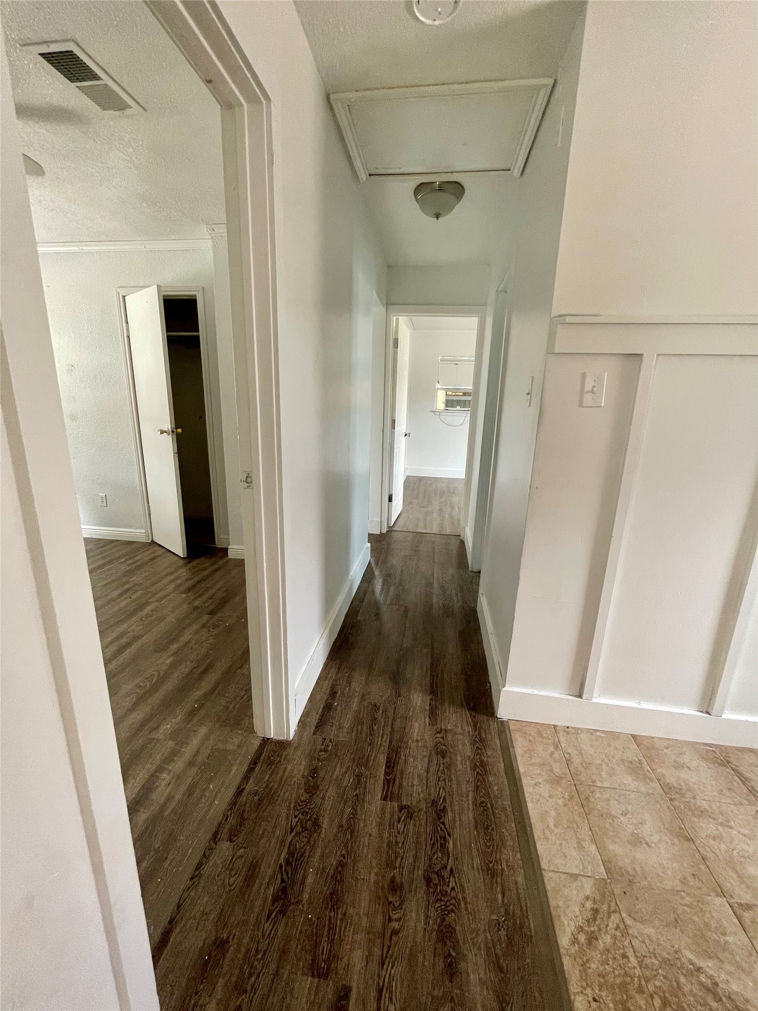 893 County Road 3376 Kempner, TX 76539 - Photo 19 of 23 a view of a hallway with wooden floor and staircase