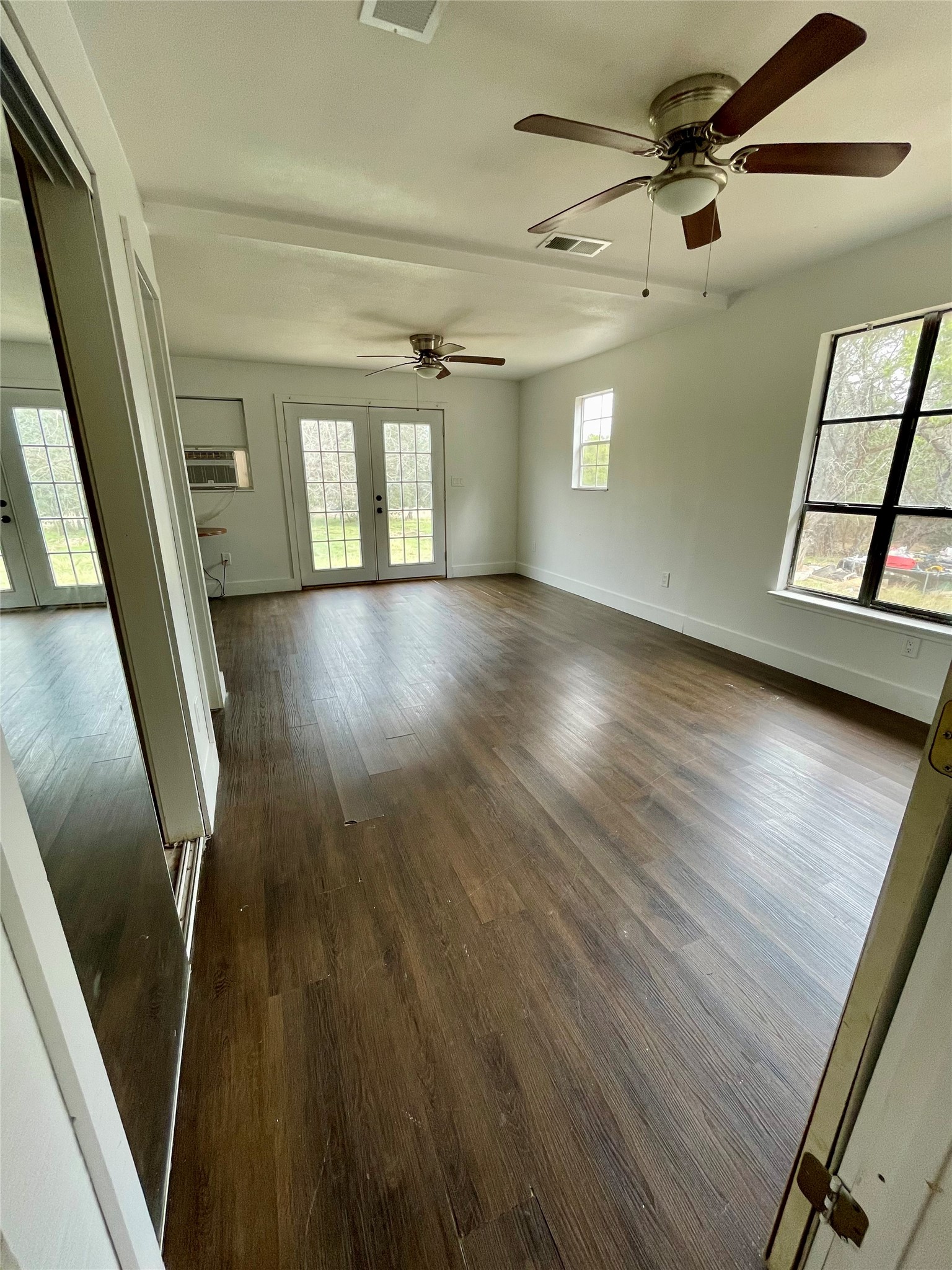893 County Road 3376 Kempner, TX 76539 - Photo 9 of 23 wooden floor in an empty room with a window