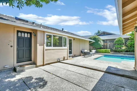a house view with a sitting space and garden space