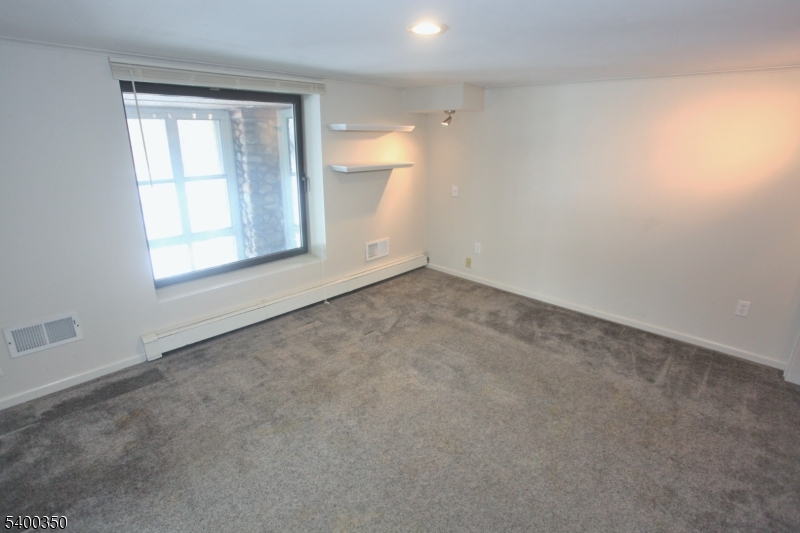 22 Choctaw Oak Ridge Oak Ridge, NJ 07438 - Photo 11 of 23 an empty room with a window