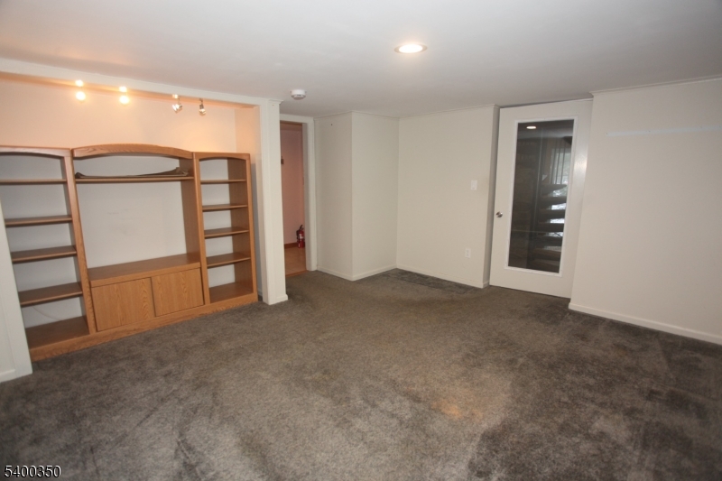 22 Choctaw Oak Ridge Oak Ridge, NJ 07438 - Photo 12 of 23 a view of empty room with wooden walls