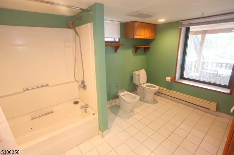 22 Choctaw Oak Ridge Oak Ridge, NJ 07438 - Photo 16 of 23 a bathroom with a toilet sink and mirror