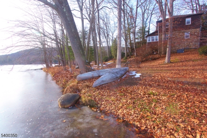 22 Choctaw Oak Ridge Oak Ridge, NJ 07438 - Photo 22 of 23 a view of a backyard with large trees