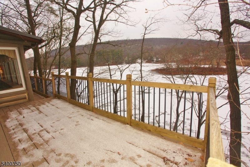 22 Choctaw Oak Ridge Oak Ridge, NJ 07438 - Photo 3 of 23 a view of a yard with wooden fence