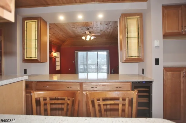 a kitchen with stainless steel appliances granite countertop a sink a stove and a microwave