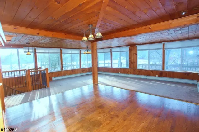 a view of an ocean with a floor to ceiling window